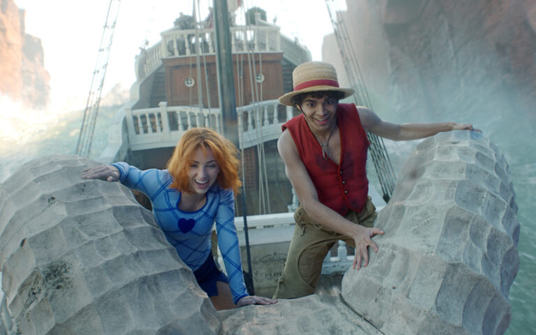 In "One Piece" two of the main characters are sitting at the bow of the ship and smiling as they go through thrashing waters.