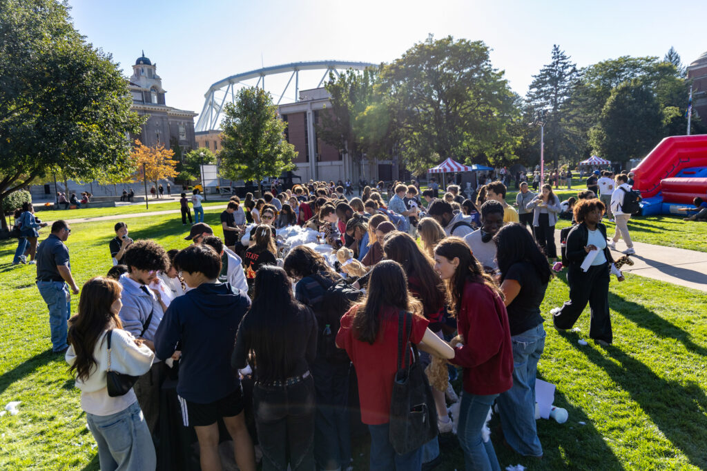 Students huddle around the build-your-own stuffed animal station during Quad-a-Palooza on Friday, Sept. 25, 2026 on The Quad.