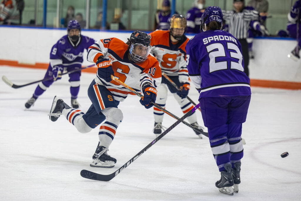 Junior defender Jessica Cheung move the puck up the ice during Syracuse's game against Stonehill on Saturday, Sept. 26, 2026, at Tennity Ice Pavilion.