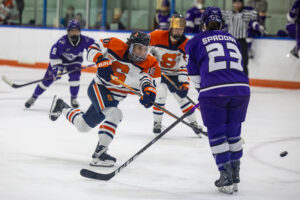 Junior defender Jessica Cheung move the puck up the ice during Syracuse's game against Stonehill on Saturday, Sept. 26, 2026, at Tennity Ice Pavilion.
