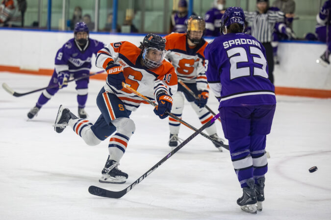 Junior defender Jessica Cheung move the puck up the ice during Syracuse's game against Stonehill on Saturday, Sept. 26, 2026, at Tennity Ice Pavilion.