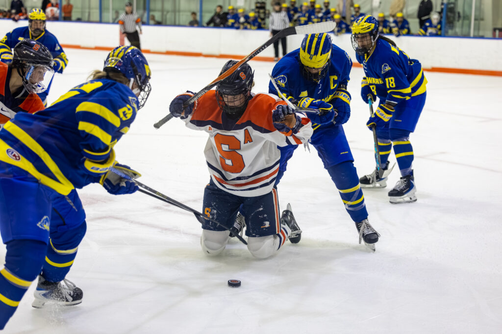 (number blocked?) fights for the puck during the Syracuse Women's Ice Hockey game vs. Delaware on Oct. 30, 2026, at Tennity Ice Pavilion.