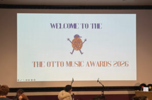 At the first ever "Otto Awards" a sign on a screen says "Welcome to the Otto Music Awards 2026."
