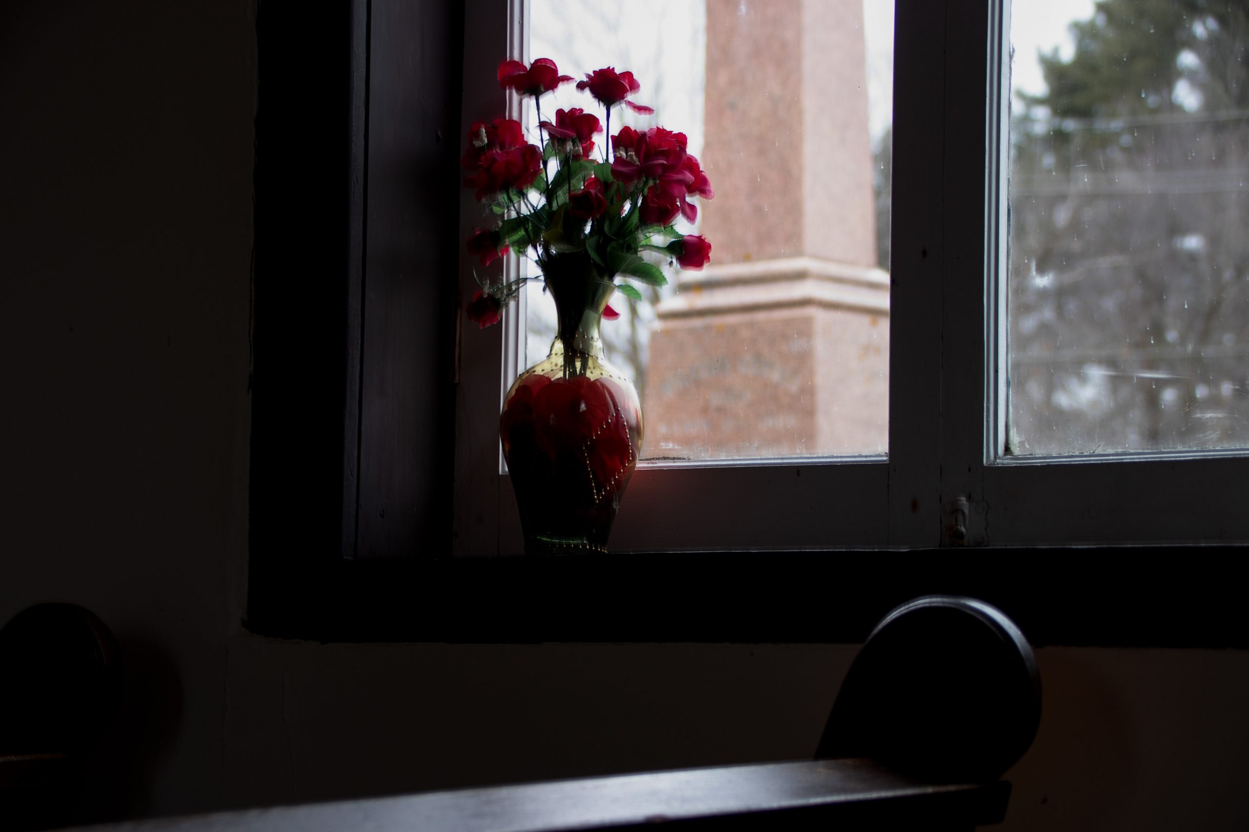 Flowers on a window sill at The Blue Church in Prescott, Ontario