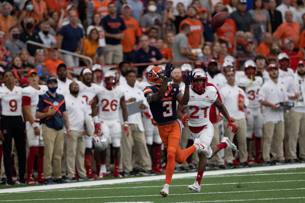 Syracuse’s Taj Harris (3) eyes a deep pass that he caught in front Rutgers’ Tre Avery during an NCAA football game, Saturday, at the Carrier Dome.