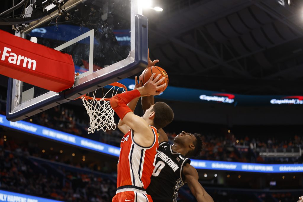 Georgetown's Aminu Mohammad (0) meets Syracuse's Cole Swider at the rim and blocks his shot during an ACC men's basketball game on Saturday at the Verizon Center.