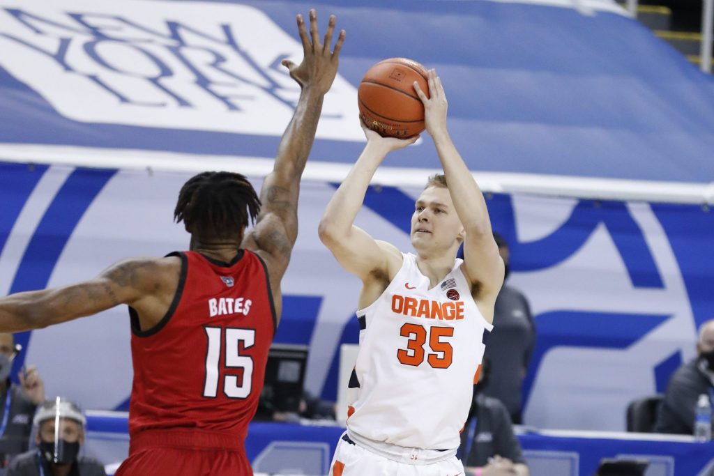 Buddy Boeheim (35) shoots over a defender during the first half of N.C. State’s game against Syracuse in the second round of the ACC Men’s Basketball Tournament in Greensboro, N.C., Wednesday, March 10, 2021.