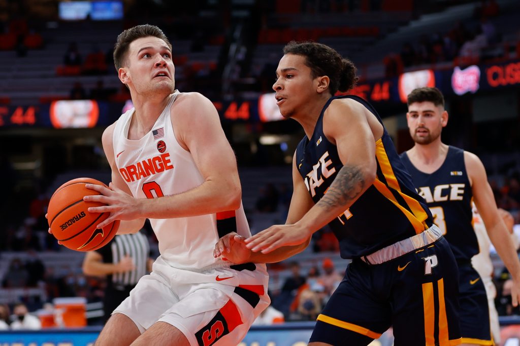 Syracuse's Jimmy Boeheim III looks past Pace University's Brandon Powell during an exhibition Men's Basketball game at the Carrier Dome on October 27, 2021.