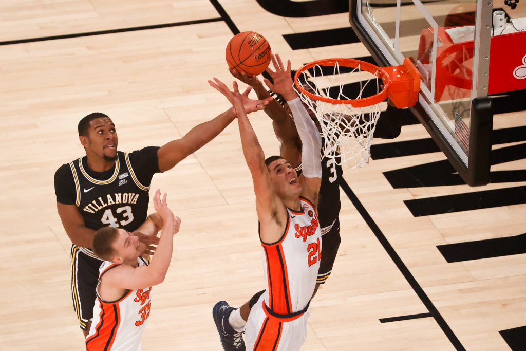Syracuse's Cole Swider attempts a shot over Villanova's Brandon Slater during the Jimmy V Classic at Madison Square Garden on December 7, 2021. Syracuse Men's Basketball in action against Villanova during the Jimmy V Classic at Madison Square Garden on December 7, 2021
