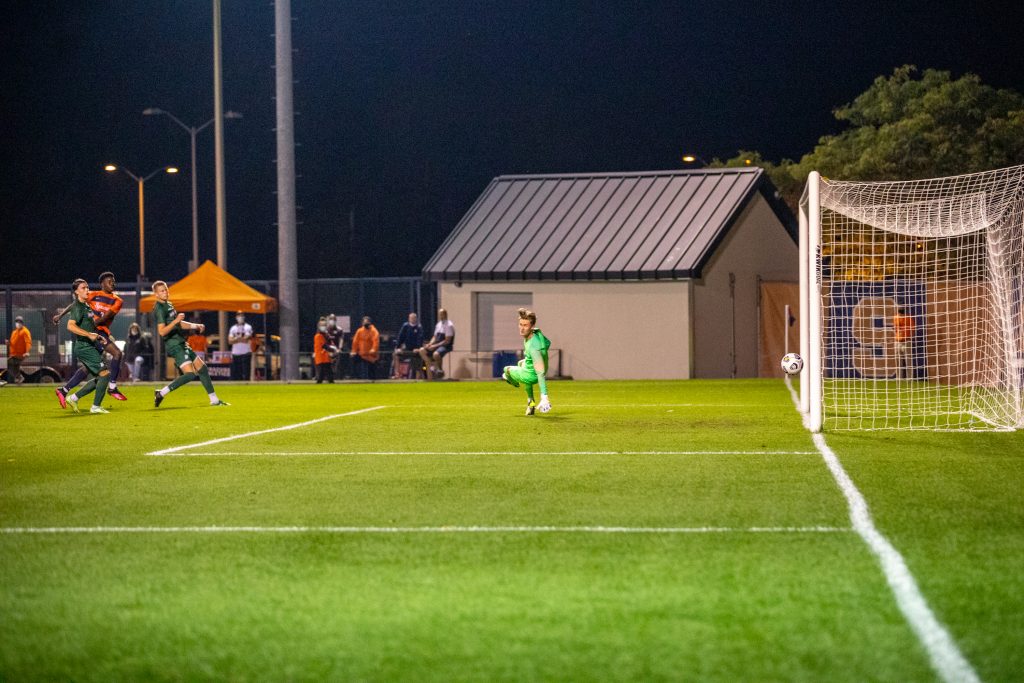 Syracuse's Deandre Kerr smashes the ball to the right of the goalie, scoring one of two goals on the night of September 14th, 2021.