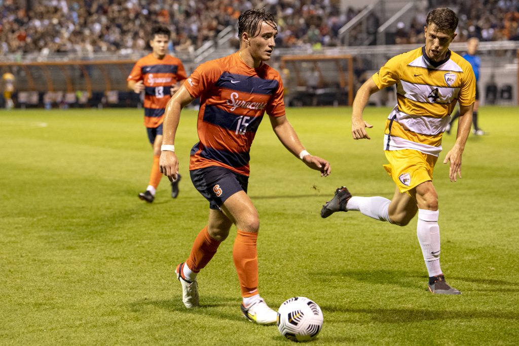 Freshman midfielder Curt Calov controls a ball during the Syracuse men's soccer season opener against Drexel at the SU Soccer Stadium, August 26.