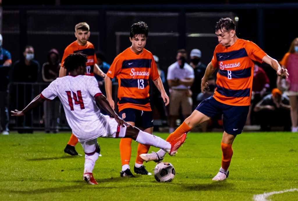 Syracuse's Georgia Kocevski (8) and Louisville's Eric Danquah (14) try and graduate possession simultaneously as Syracuse's Colin Biros (13) looks on.