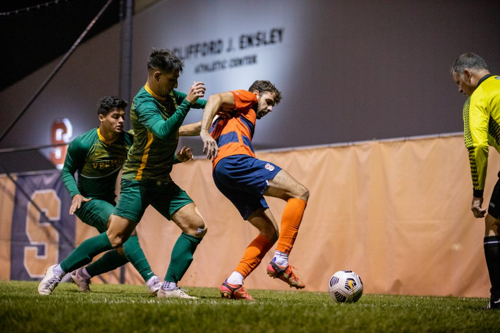 Manel Busqets (10) battles for possession during the Syracuse University Men's Soccer game vs UVM.
