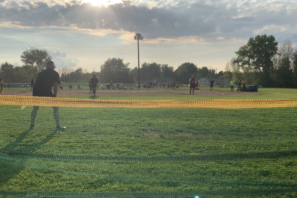 Outfielders guard the fence from fly balls on the diamond at the SSA Kickball Park.