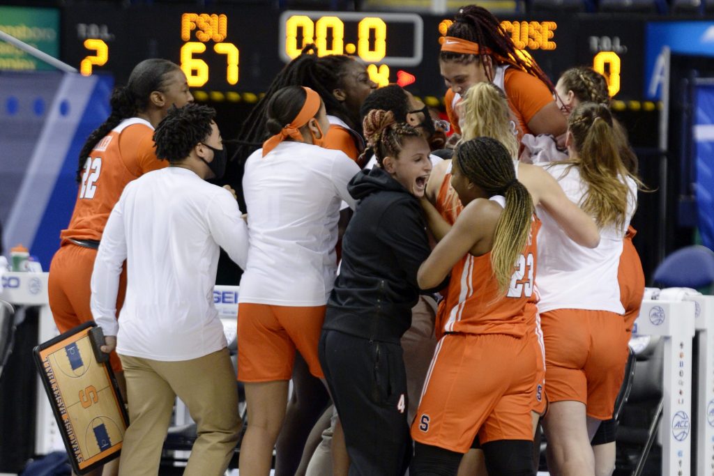 The Orange celebrate after being Florida State on a buzzer beater during the 2021 New York Life ACC Women’s Basketball Tournament.