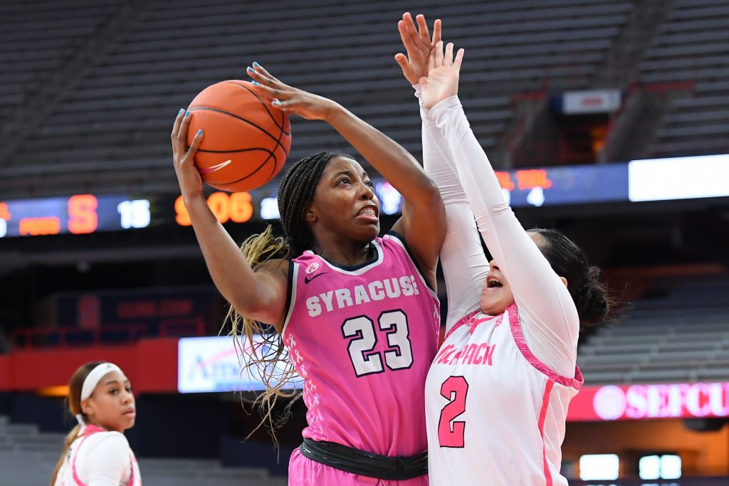 Feb 28, 2021; Syracuse, New York, USA; Syracuse Orange guard Kiara Lewis (23) shoots the ball against the defense of NC State Wolfpack guard Raina Perez (2) during the first half at the Carrier Dome. Mandatory Credit: Rich Barnes-USA TODAY Sports