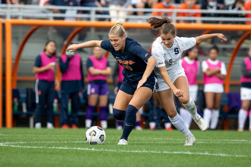 Syracuse Women's soccer player Pauline Matchens battles Virginia's Taryn Torres for the ball in the their matchup on Sunday, October 10th, 2021.
