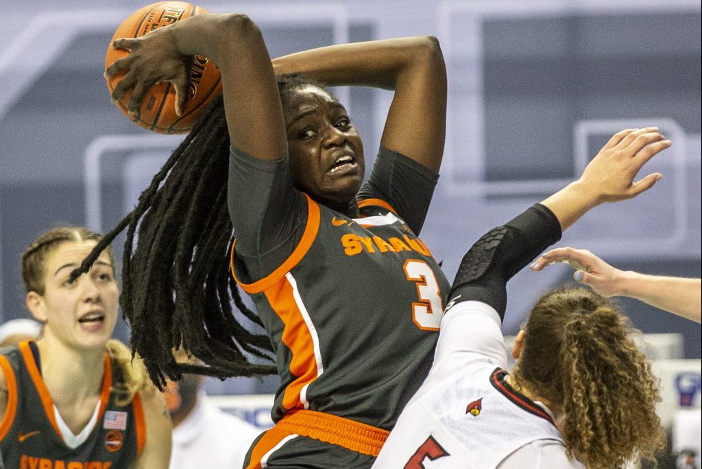 Syracuse's Maeva DjaldiÐTabdi pu lls down an offensive rebound during an NCAA college basketball game with Louisville in the Atlantic Coast Conference tournament at the Greensboro Coliseum in Greensboro, N.C., on Saturday, March 6, 2021.