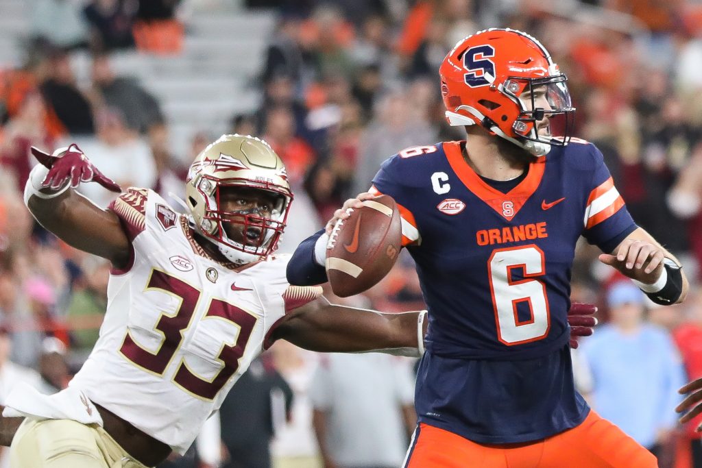 Florida State's Amari Gainer (33) swoops from behind to sack Syracuse Quarterback Garrett Shrader.