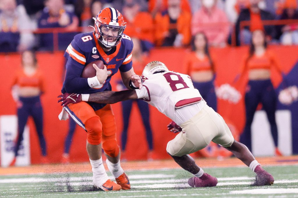 Quarterback Garrett Shrader tries to run away from Florida State defensive back Renardo Green on November 12, 2022.