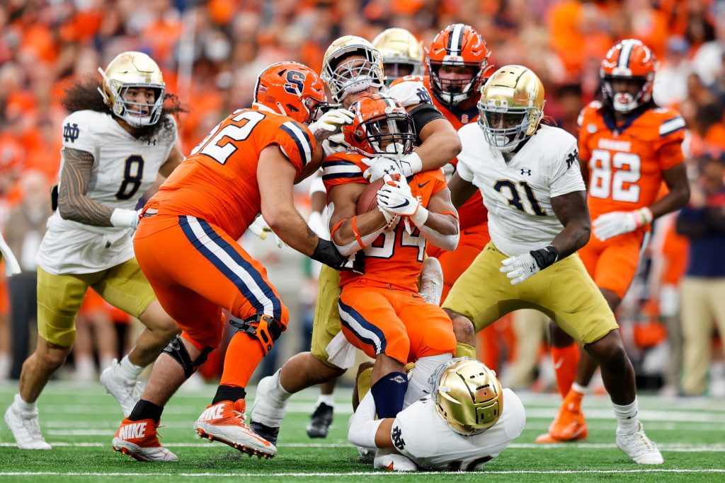 SYRACUSE, NY - OCTOBER 29: Sean Tucker #34 of the Syracuse Orange is stopped by the Notre Dame Fighting Irish at JMA Wireless Dome on October 29, 2022 in Syracuse, New York. (Photo by Isaiah Vazquez/The Newshouse)