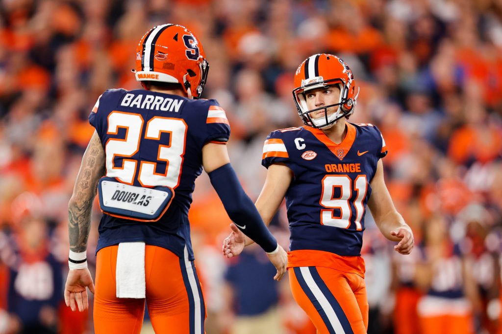 SYRACUSE, NY - SEPTEMBER 23: Andre Szmyt #91 of the Syracuse Orange celebrates with David Obeng-Agyapong #23 of the Syracuse Orange after scoring a field goal against the Virginia Cavaliers at JMA Wireless Dome on September 23, 2022 in Syracuse, New York. Szmyt scored 5 field goals on the night against the Cavaliers. (Photo by Isaiah Vazquez)