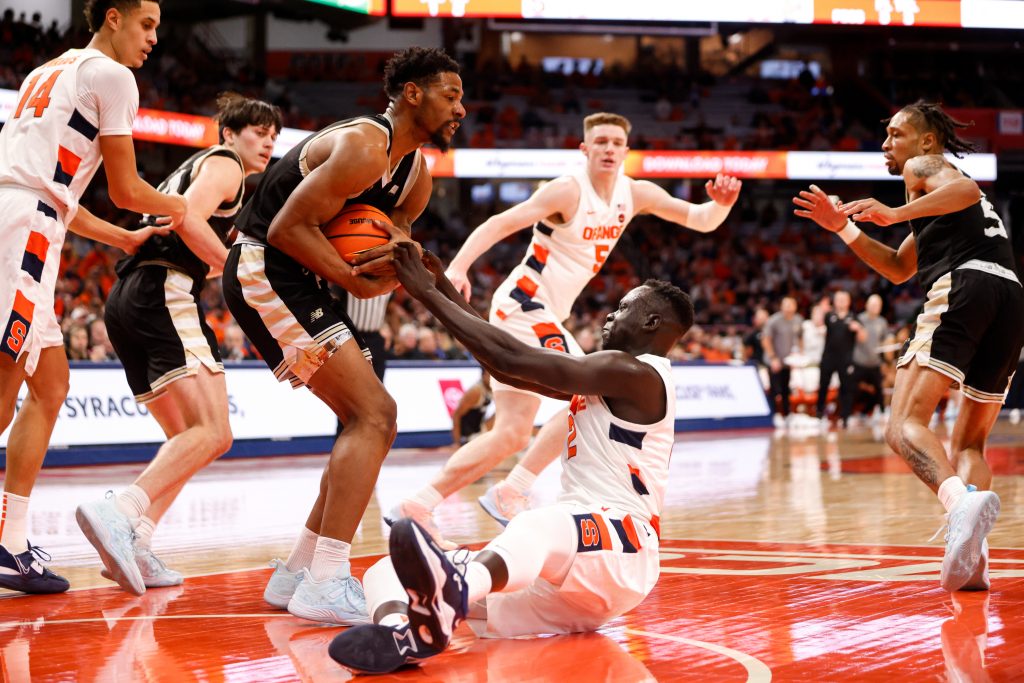 Syracuse's John Bol Ajak (2) tries to wrestle the ball away from Bryant's Antwan Walker.