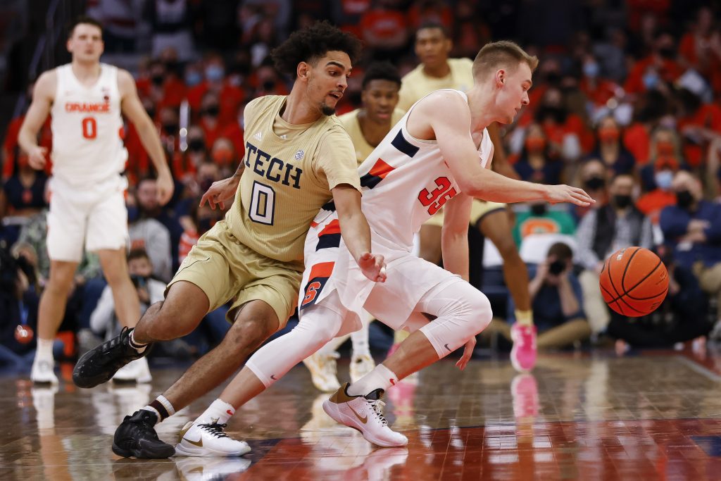 Syracuse's Buddy Boeheim (35) spins away and seals off Georgia Tech's Michael Devoe.