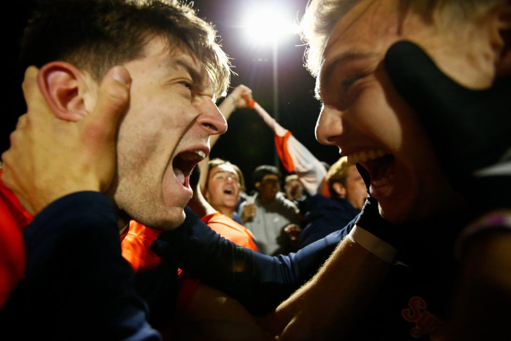 SYRACUSE, NY - NOVEMBER 9: Jeorgio Kocevski #8 of Syracuse Orange reacts with a teammate after winning the ACC Semifinal against the Virginia Cavaliers at SU Soccer Stadium on November 9, 2022 in Syracuse, New York.
