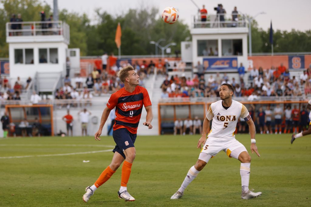 Syracuse's Julius Rauch (9) and Iona's Frederico Russo (5) eye a loose ball soaring high in the air.