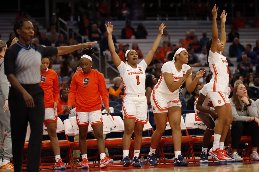 The bench cheers as a teammate makes a 3 at the Syracuse women's basketball game vs. Colgate on Nov. 10, 2022, at the JMA Wireless Dome.