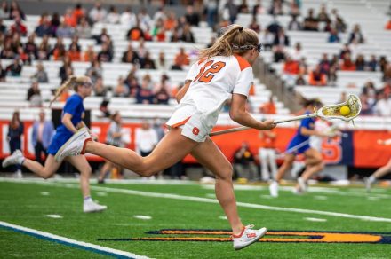 Katie Goodale (12) craddles the ball down the field. Taken by Charlotte Little.