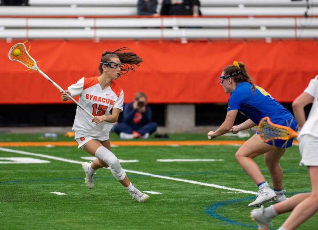 Natalie Smith (15) runs around Pitt defender