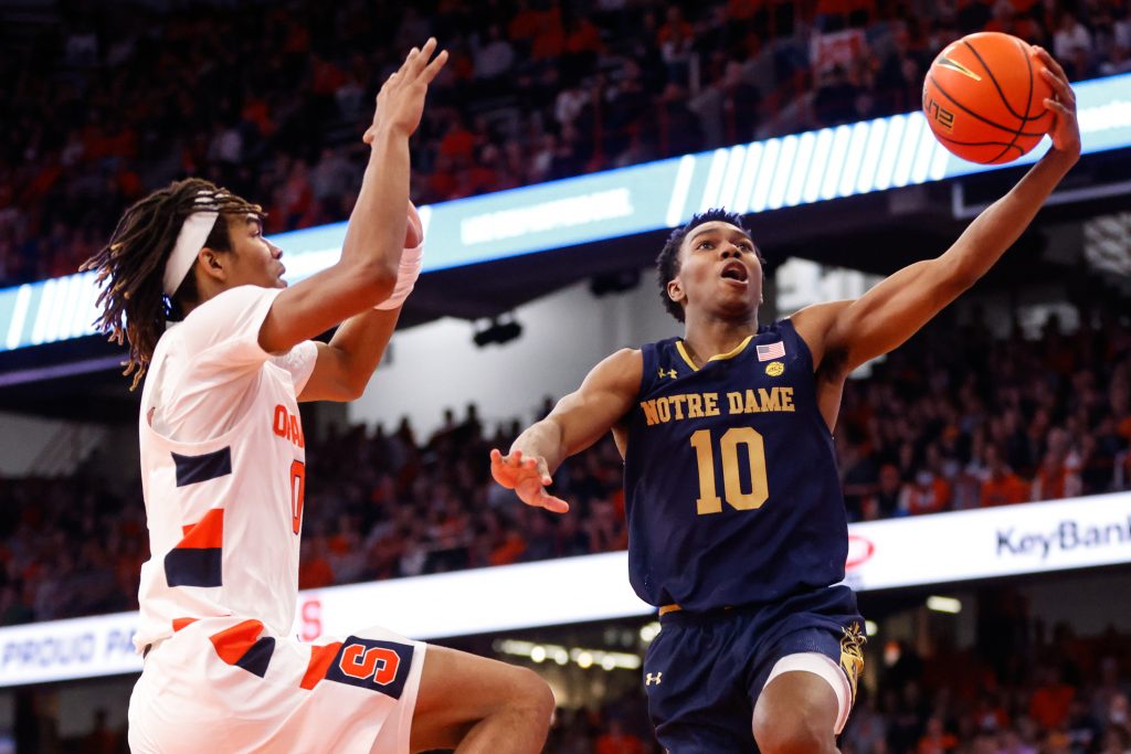 Notre Dame's Marcus Hammond (10) goes up for shot as Syracuse's Chris Bell (0) attempts to block during an ACC basketball game Saturday at JMA Wireless Dome.