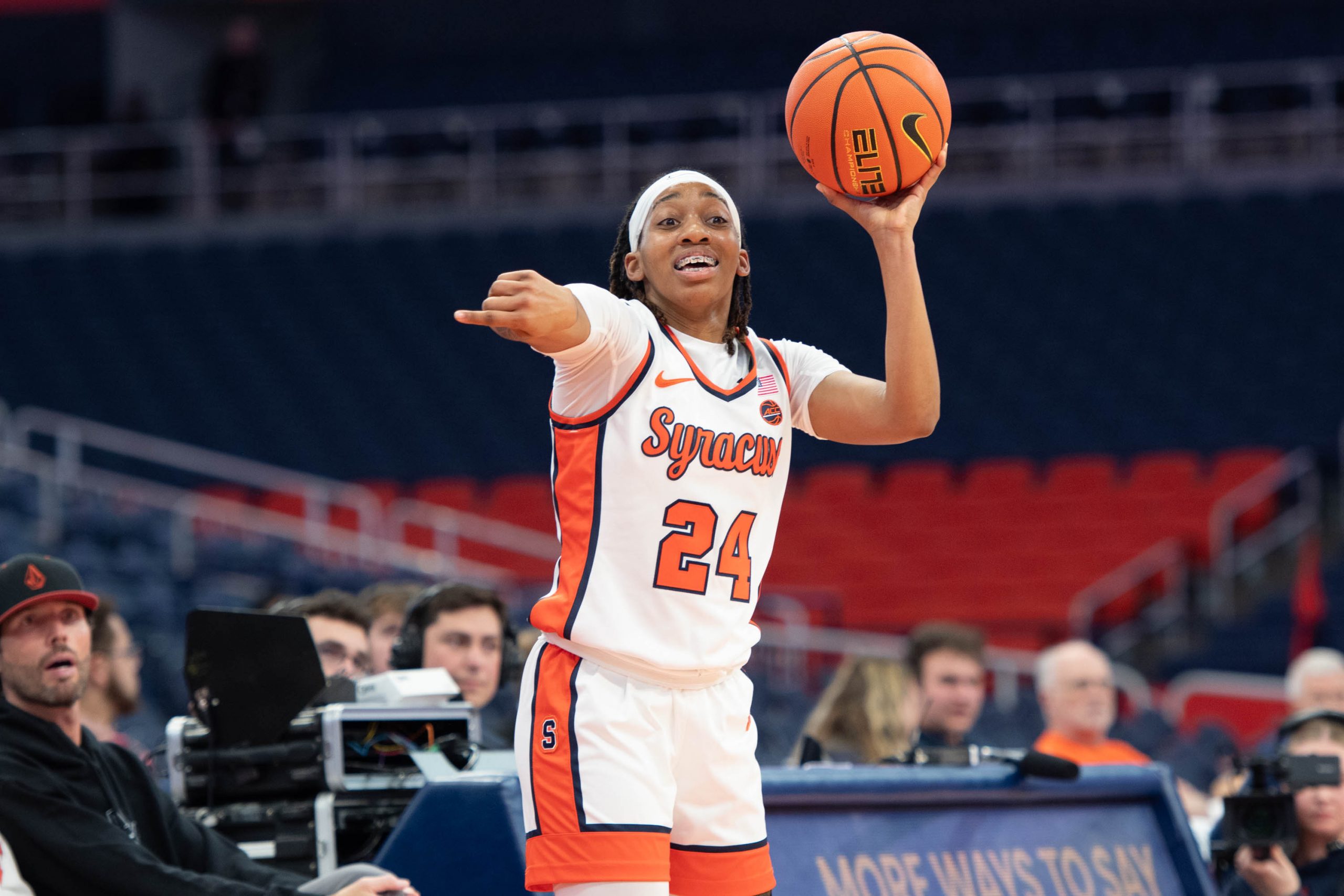 Dominique Camp signals to her attacking teammates to weave the defense in the first quarter of the SU vs. University of Albany Womens basketball game Wednesday evening at the JMA Wireless dome.