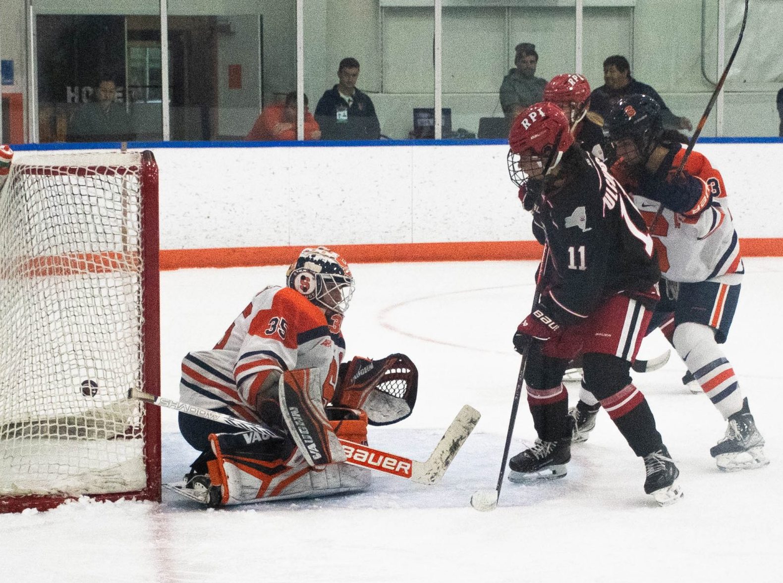RPI's Natalie Tulchinsky (11) scores a goal against SU goalie Allie Kelley (35) during a powerplay at 13:06 into the third period of the Syracuse-RPI women’s ice hockey match on Oct. 11, 2024, at the Tennity Ice Pavilion.