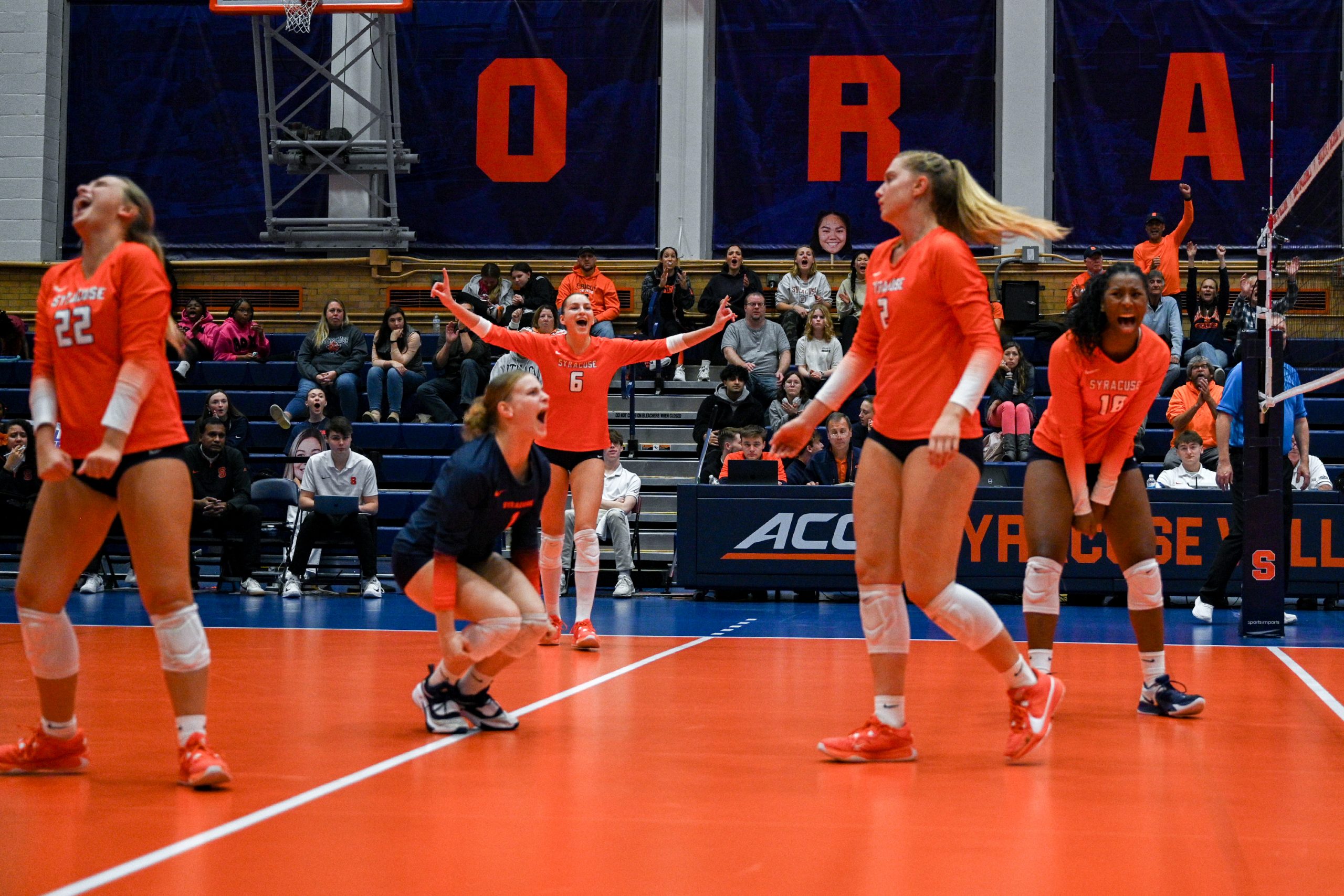 The Syracuse University volleyball team celebrates a point after a successful blocked spike by setter Veronica Sierzant during their match against Boston College November 20, 2024.