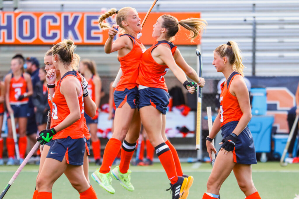 Members of SU's field hockey bump chests during their match against Lock Haven on Friday, August. 29, 2025, at J.S. Coyne Stadium.