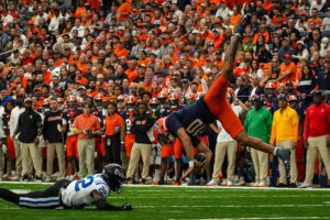 Syracuse Redshirt Sophomore Rickie Collins (10) is upended by Duke CB Moussa Lane (22). The inexperienced quarterback was pressured constantly throughout the game, but did not utilize his legs effectively, attempting 5 rushes for 9 yards.
