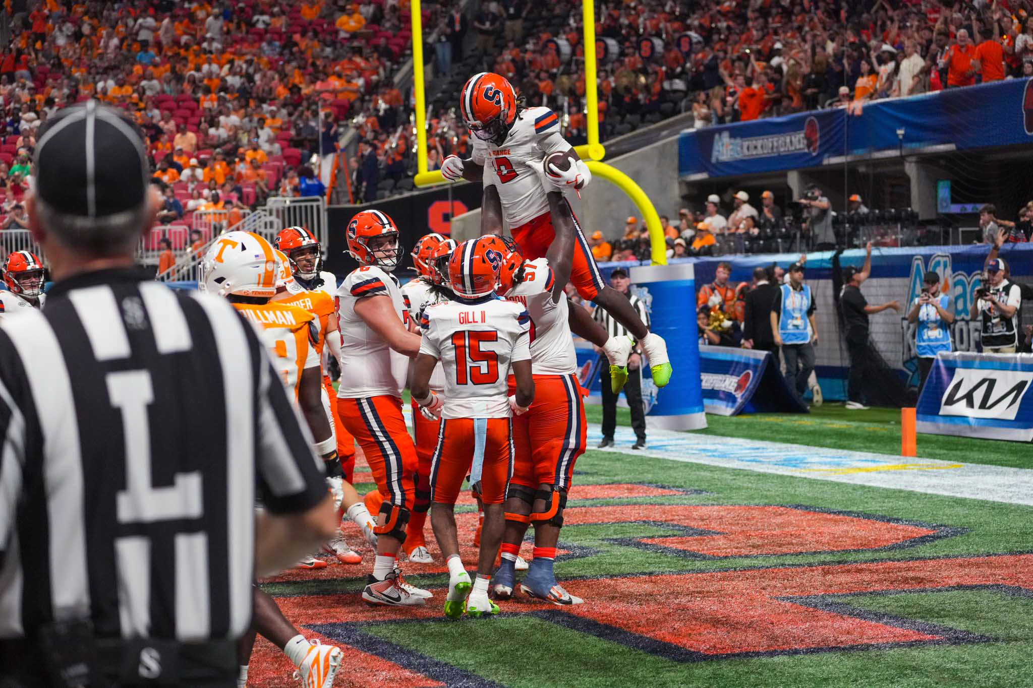 Offensive lineman Da'Metrius Weatherspoon (57) carries Wide receiver Johntay Cook (2) after
touchdown as Syracuse faced Tennessee on Saturday for the Aflac Kickoff Game at Mercedes-Benz Stadium in Atlanta.