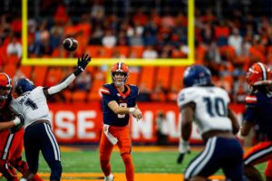Syracuse quarterback Steve Angeli snake-eyes' a pass during their game tying drive against UCONN on Saturday at the JMA Wireless Dome. (Photo by Jack Henry / Newhouse School)