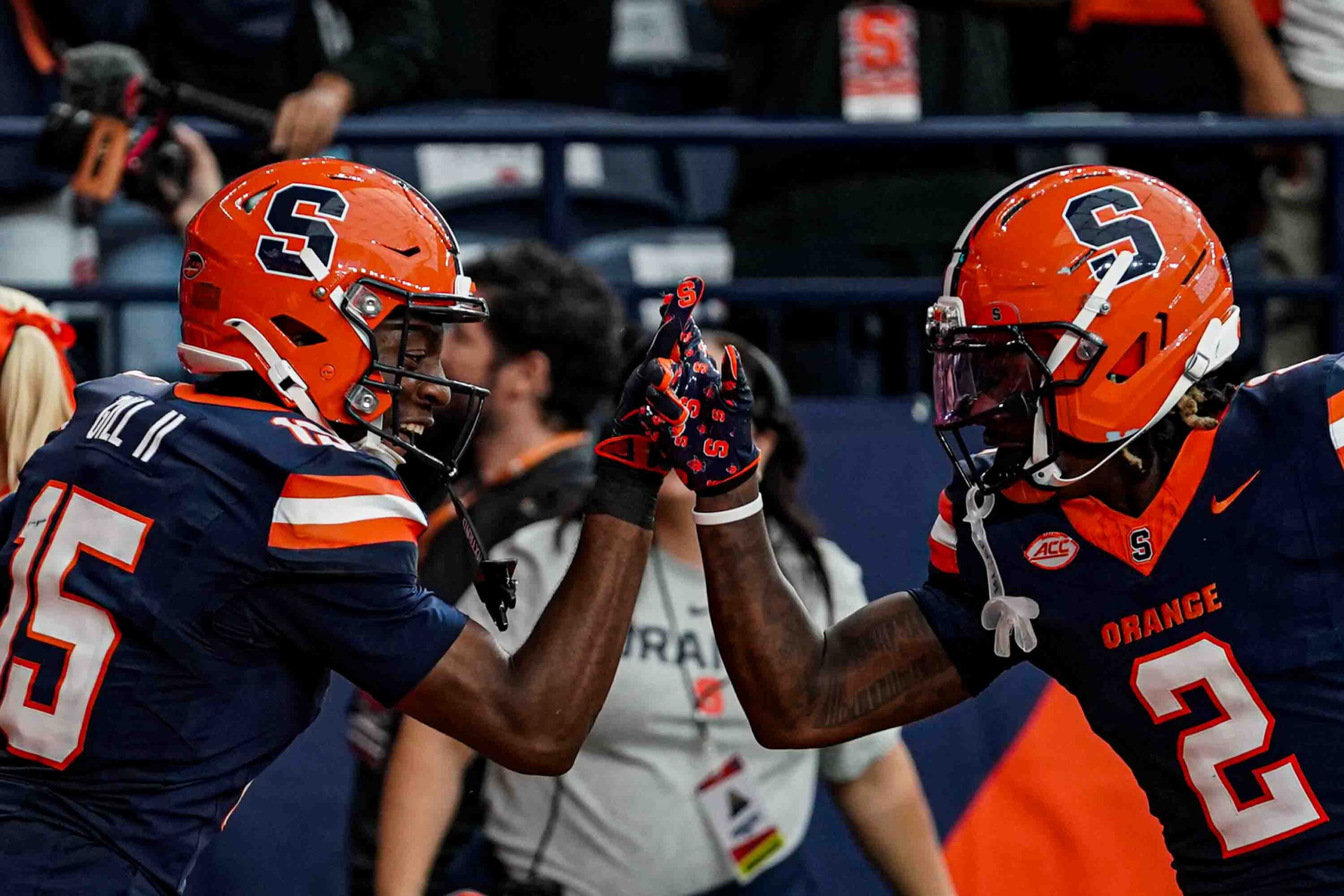 Syracuse wide receivers Darrell Gill Jr. and Johntay Cook celebrate after tying the game against UCONN at the JMA Wireless Dome on Saturday.