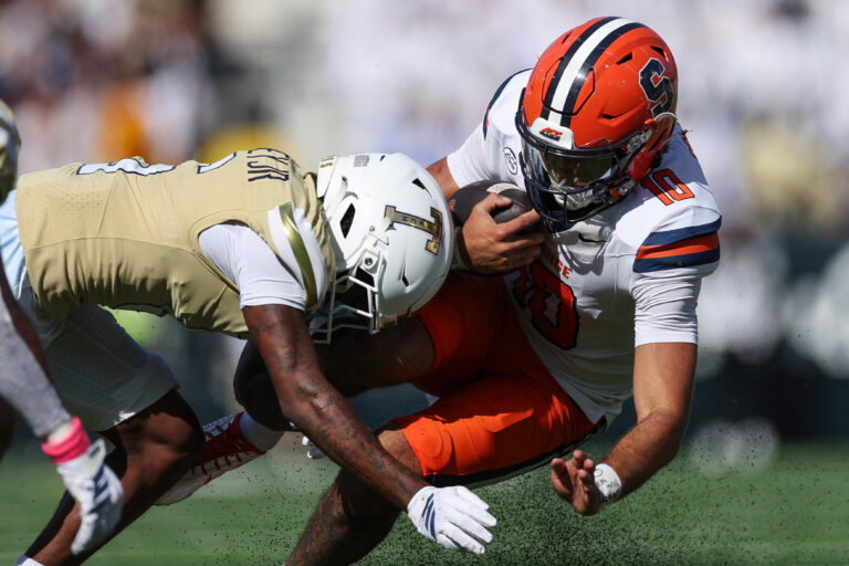 ATLANTA, GEORGIA - OCTOBER 25: Rickie Collins #10 of the Syracuse Orange is hit by Rodney Shelley #6 of the Georgia Tech Yellow Jackets at Bobby Dodd Stadium on October 25, 2025 in Atlanta, Georgia. (Photo by Randy J. Williams/Getty Images)