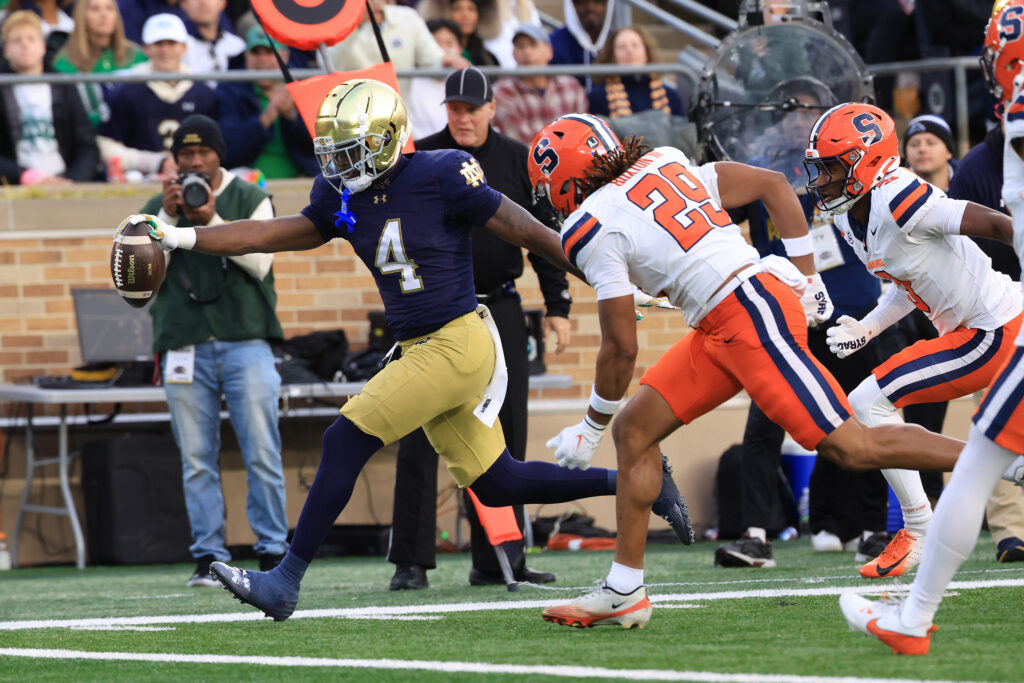 Jeremiyah Love #4 of the Notre Dame Fighting Irish scores a touchdown during the first half against the Syracuse Orange at Notre Dame Stadium on November 22, 2025 in South Bend, Indiana.