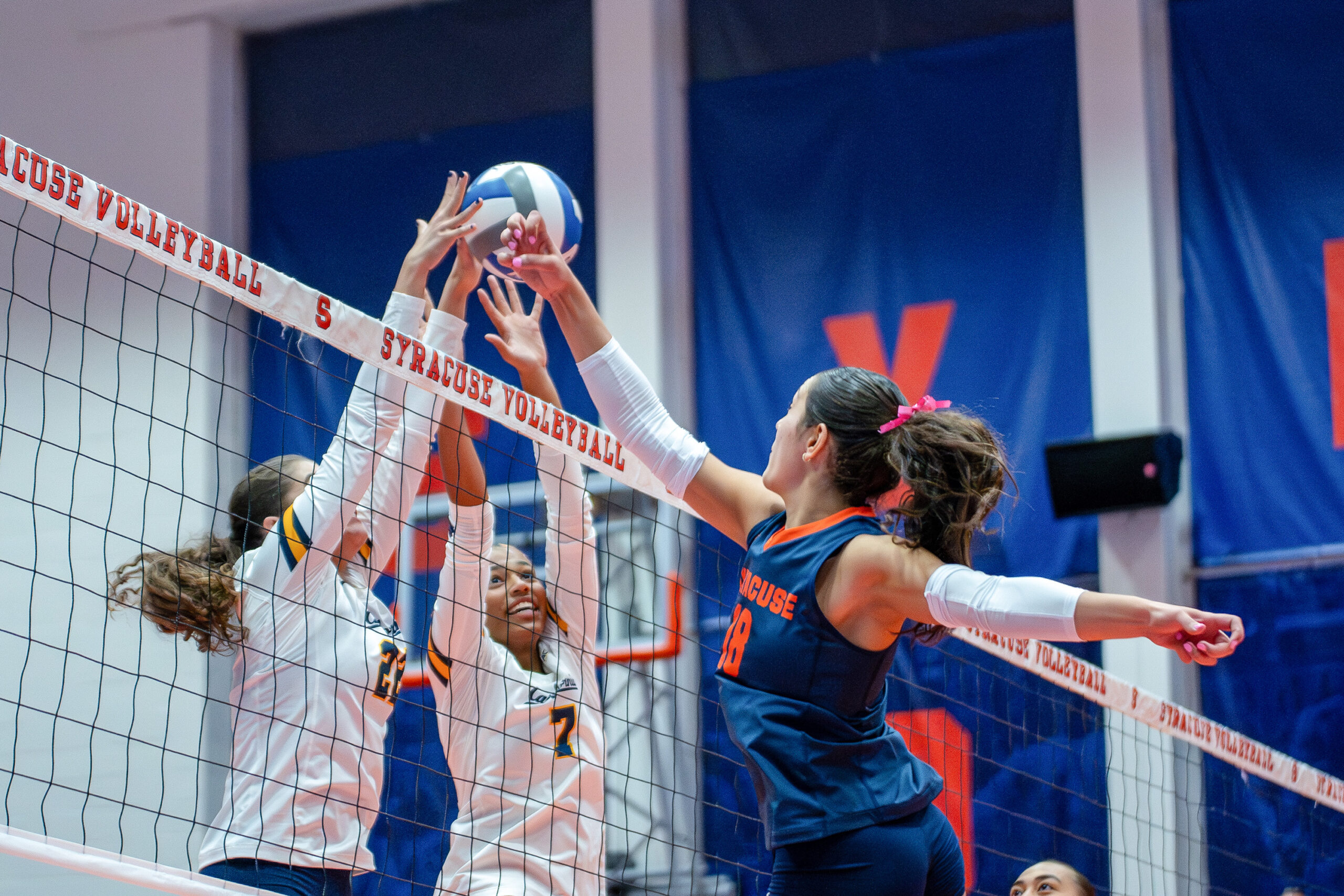 Syracuse outside Gabriella McLaughlin jousts with California's Mikayla Hayden, and Maria Stirbu on Friday at the Womens Building.