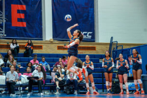 Syracuse outside Gabriella McLaughlin flys through the air as she serves to the California defense Friday at the Woman's Building.