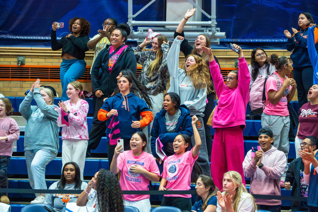 Syracuse Women's Volleyball fans arrive in all shades of pink for breast cancer awareness night on Friday at the Women's Building.