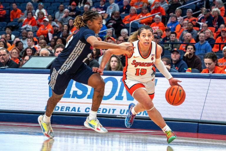 Syracuse guard Angelica Velez looks to get past Howard guard Zoe Stewart on Sunday at the JMA Wireless Dome.