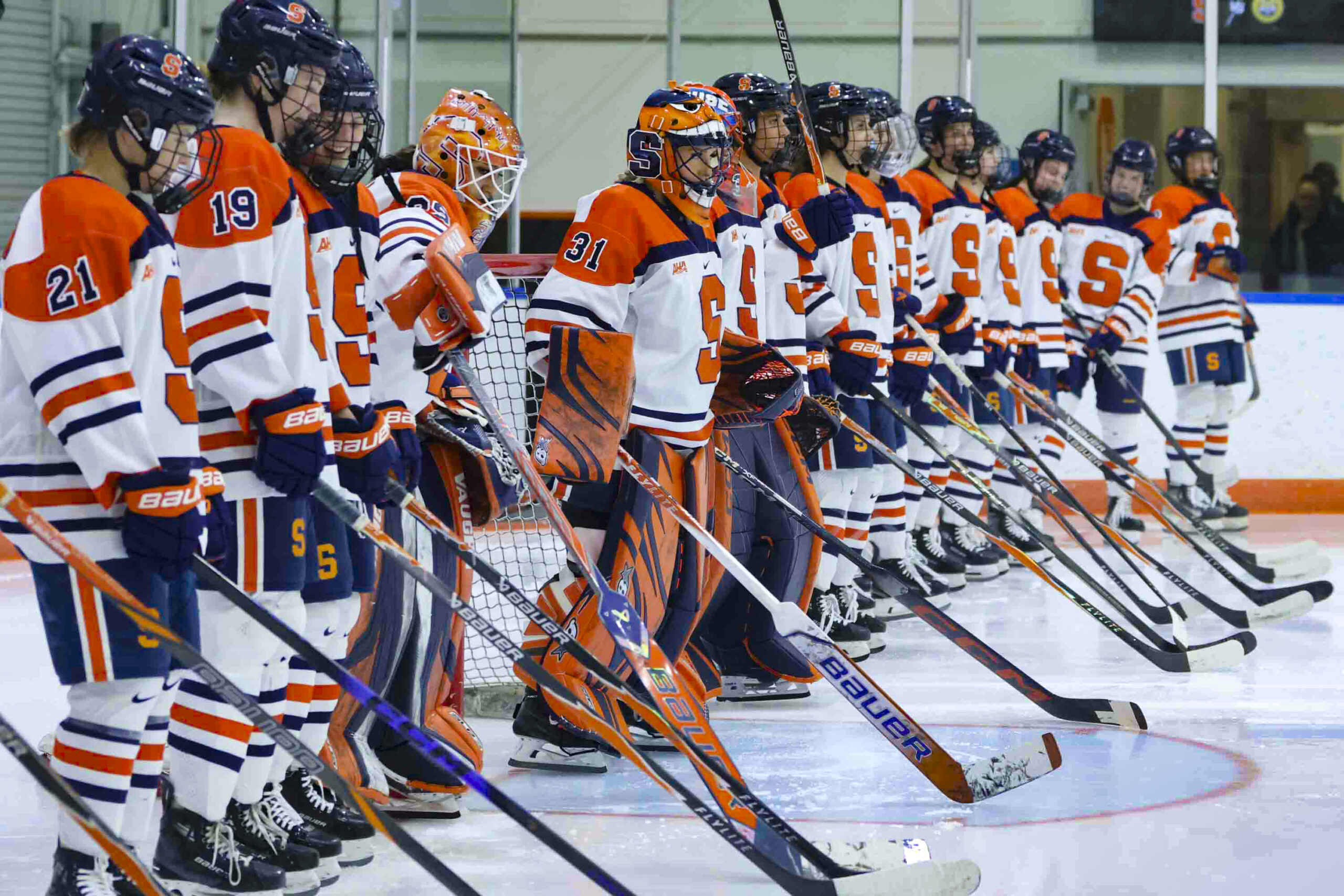 Syracuse University’s Women’s Ice Hockey team stands during the lineup announcements for their game against the Quinnipiac Bobcats on Friday, October 10, 2025 at home, the Tennity Ice Pavilion. This is the first of a two-game stand against the Bobcats, who are ranked #7 in the nation at time of competition.