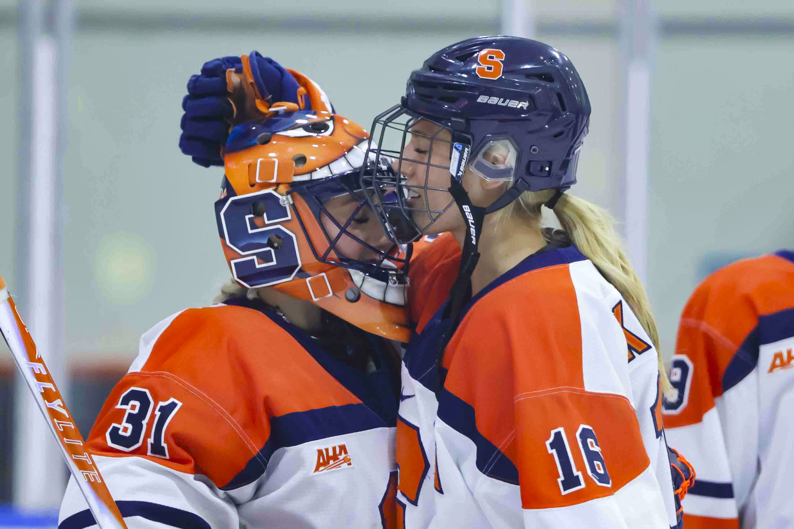 Syracuse University Women’s Ice Hockey players Jackson Kinsler (16) and Ava Drabyk (31) share a moment of reflection before puck drop against the Quinnipiac Bobcats on October 10, 2025 at home, the Tennity Ice Pavilion.